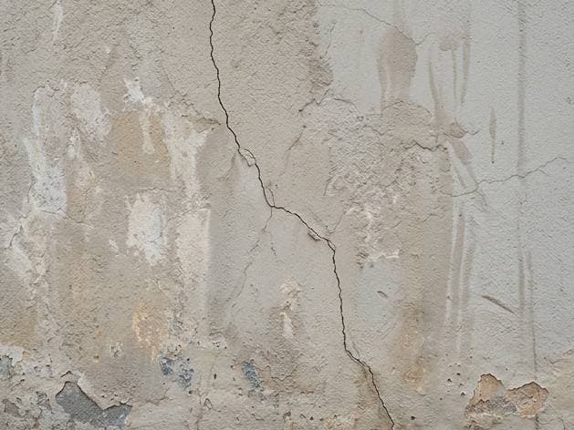 High-build stucco or textured wall preparation on a Gauteng estate or commercial façade