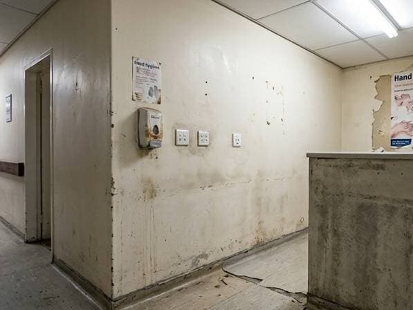 Healthcare suite interior painting with containment and low-VOC coatings