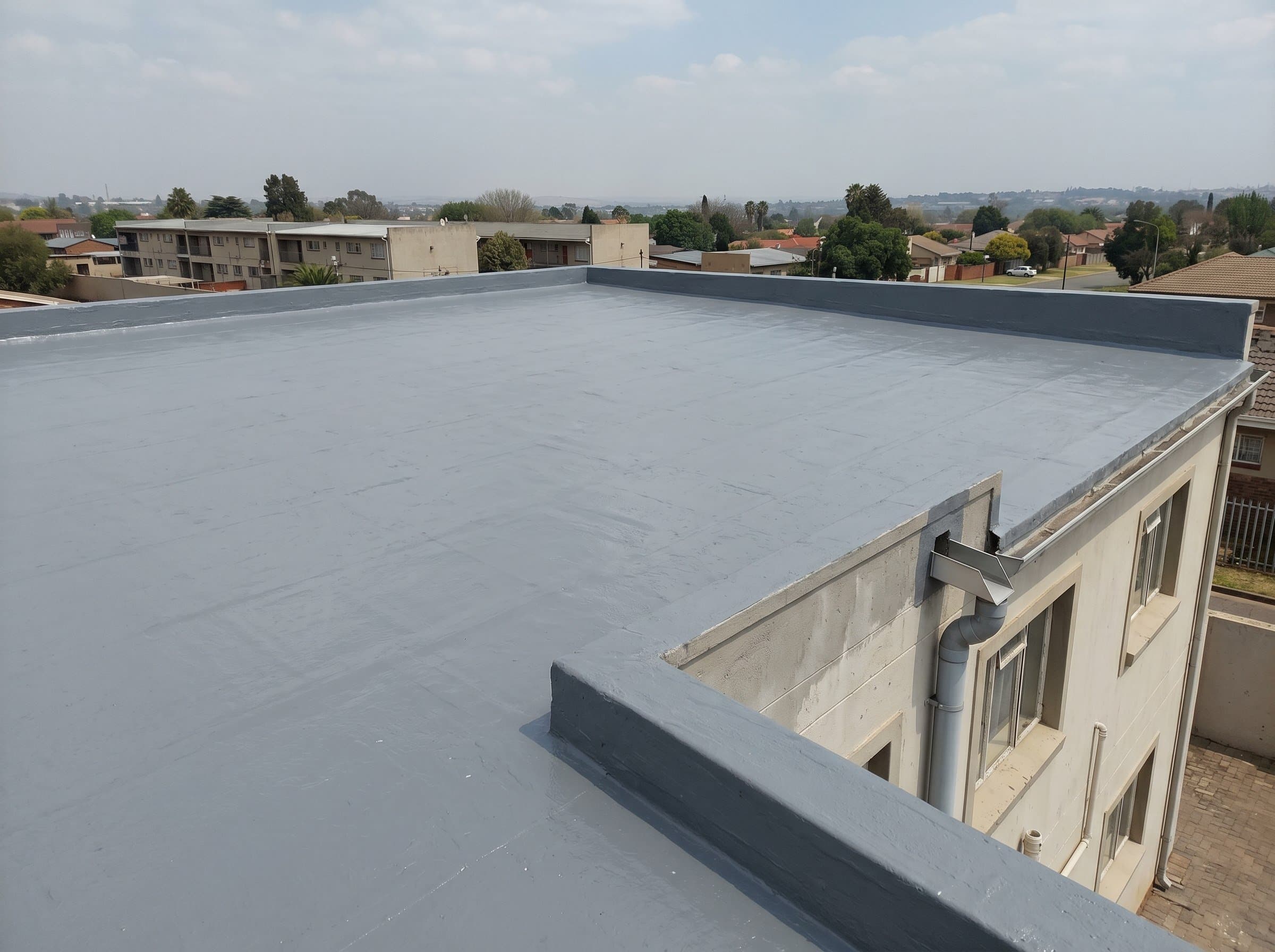 Completed flat concrete roof waterproofing on a modest Gauteng building