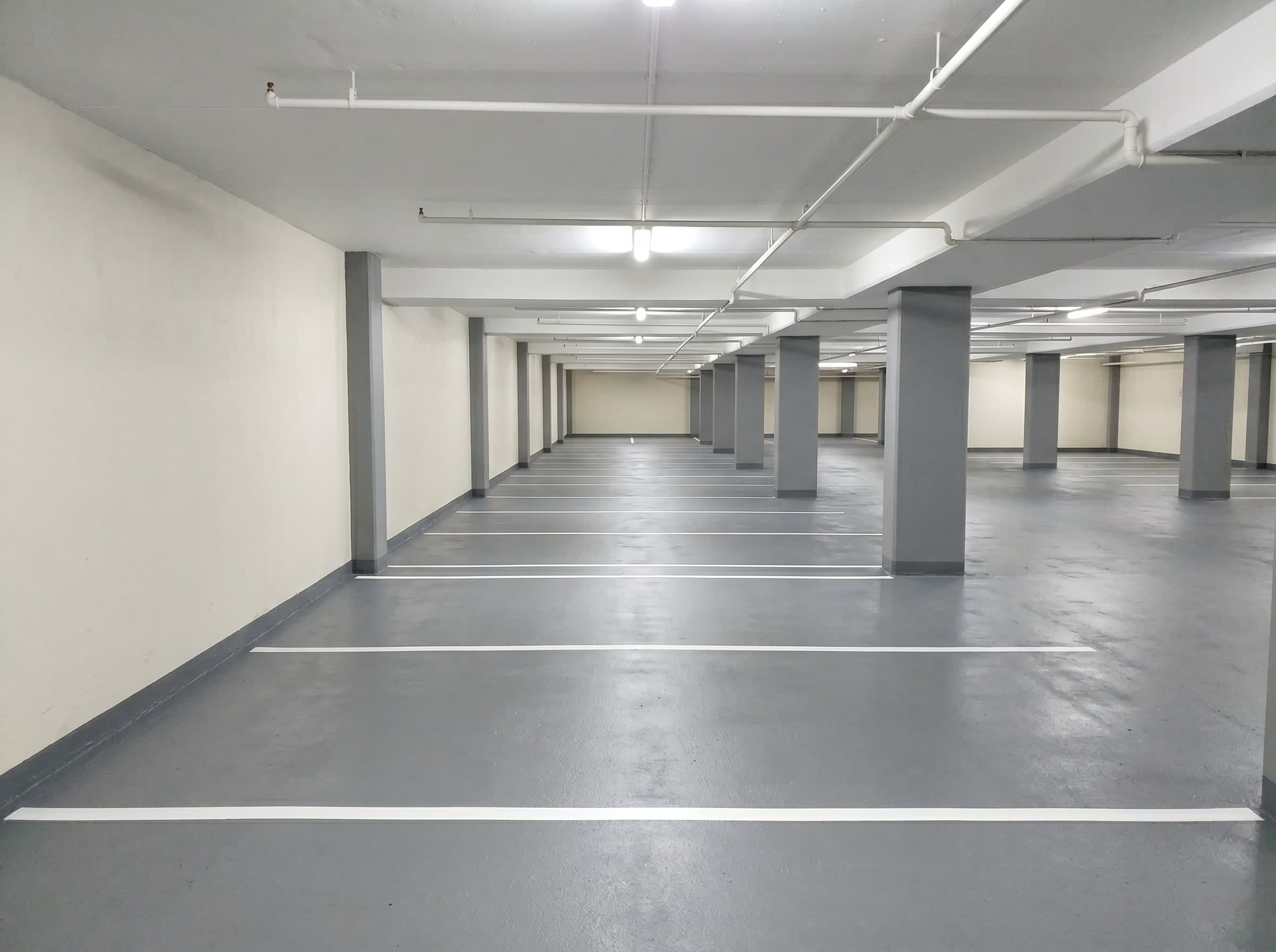 Completed deck and wall coatings in a small neighbourhood shopping centre parking garage in Gauteng
