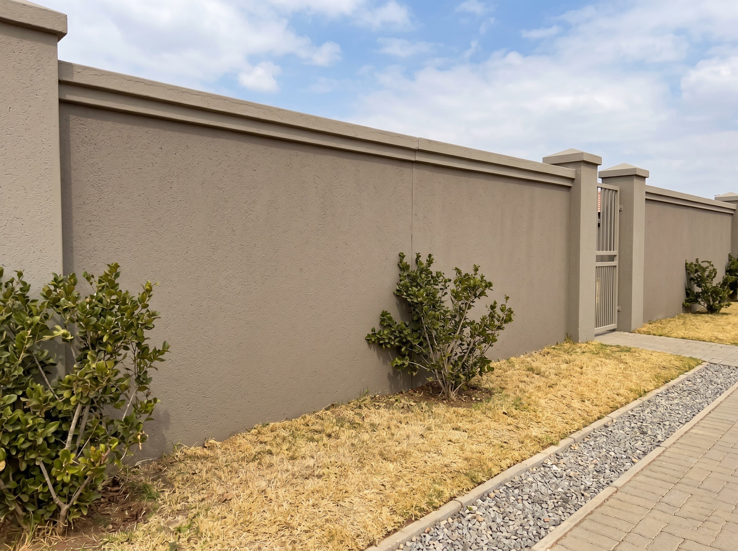 Finished decorative cement finish on a townhouse boundary wall