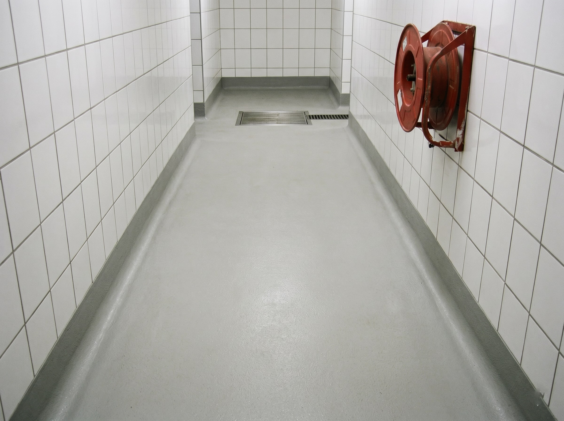 Close-up of hygienic floor coving and wall splash zone in a Gauteng food prep area