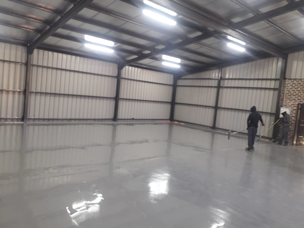 Industrial epoxy flooring with integral coving in a food-processing facility