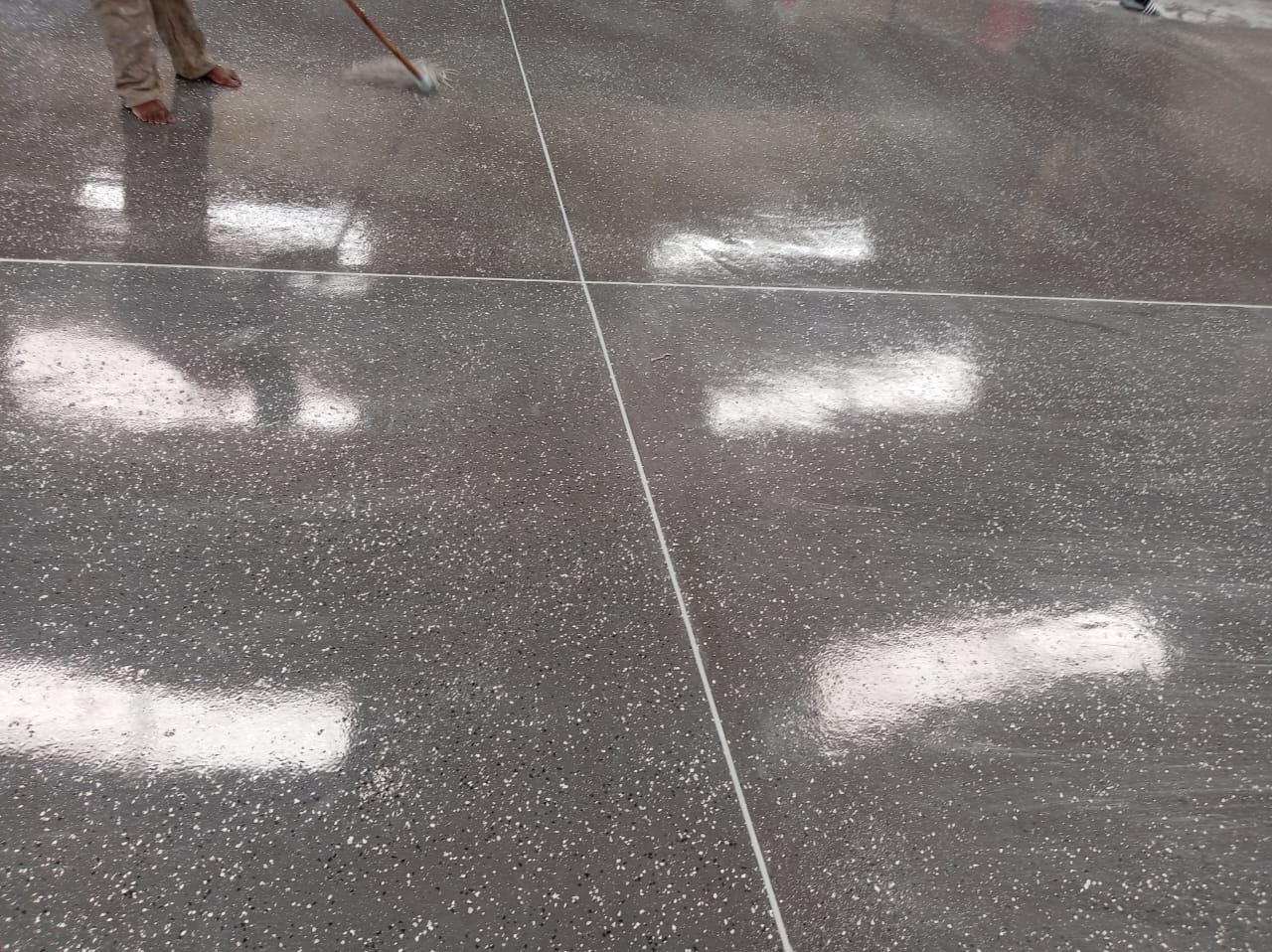 Torch-on flat roof waterproofing with UV protection course on a commercial building