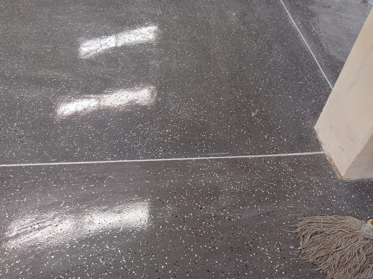 HEA airless spray painting on a warehouse tilt-up panel field