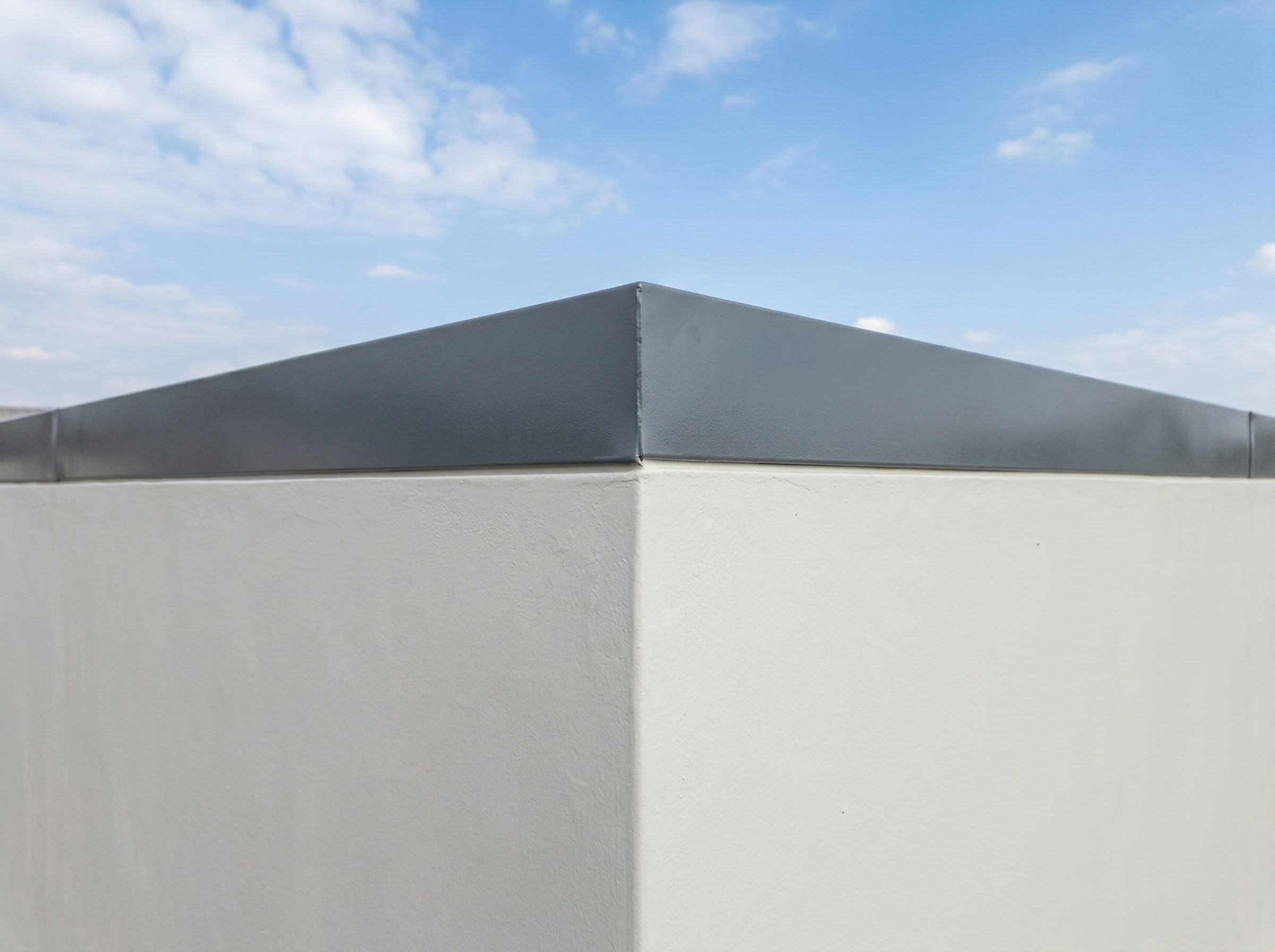 Completed boundary wall repaint with coated cap in a Gauteng estate