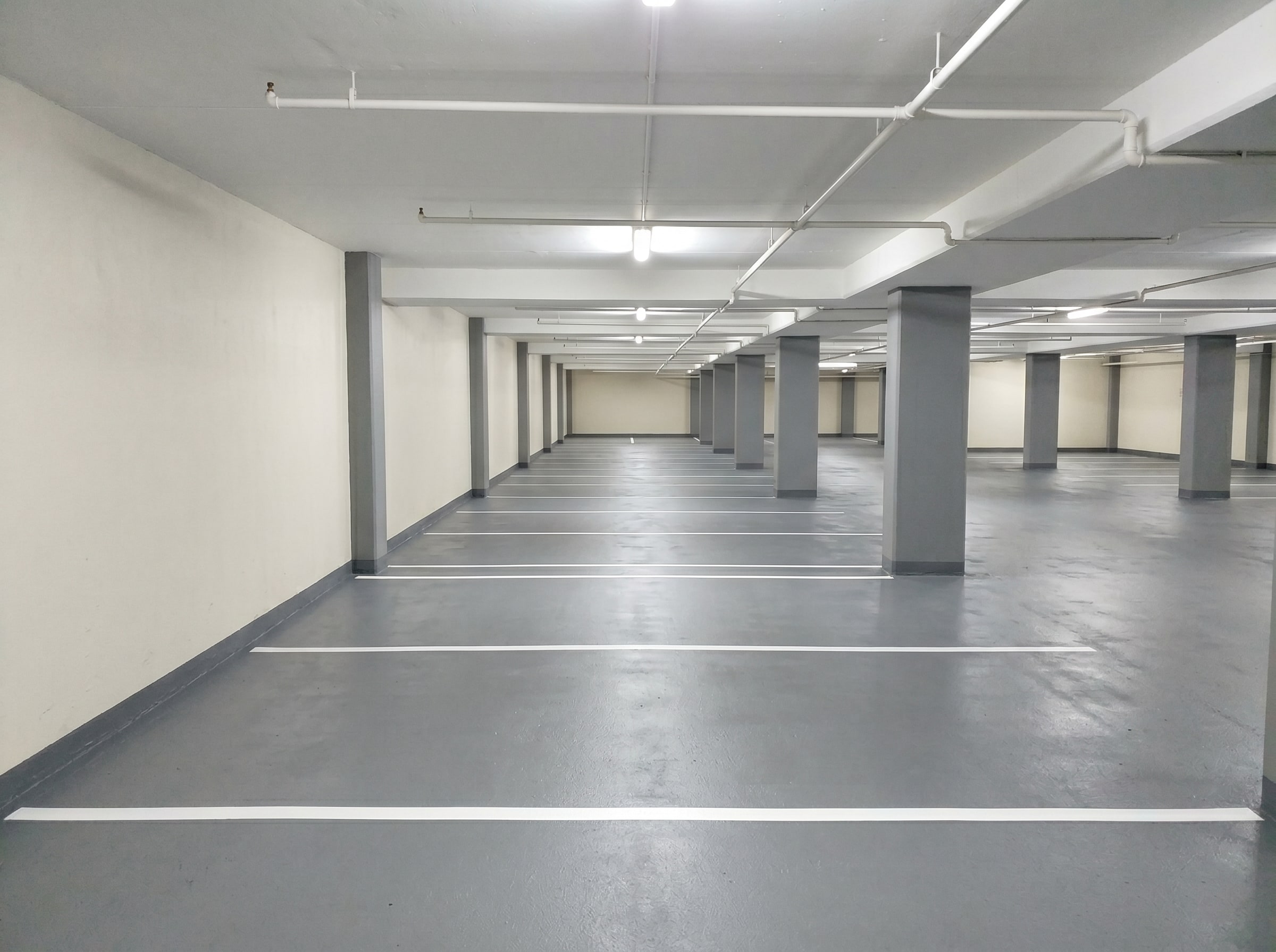 Completed deck and wall coatings in a small neighbourhood shopping centre parking garage in Gauteng