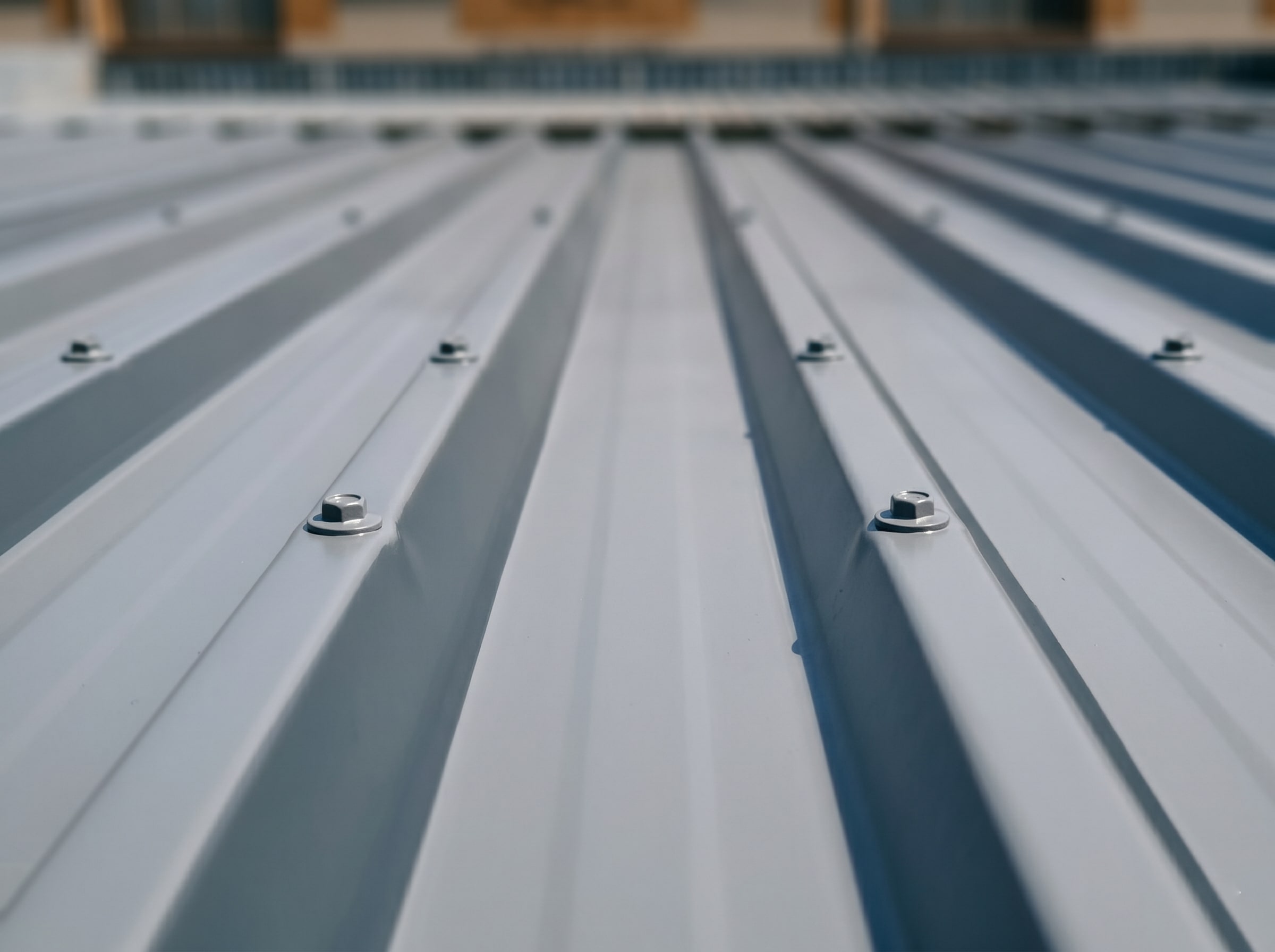 Close-up of completed protective coating on IBR corrugated roof sheeting