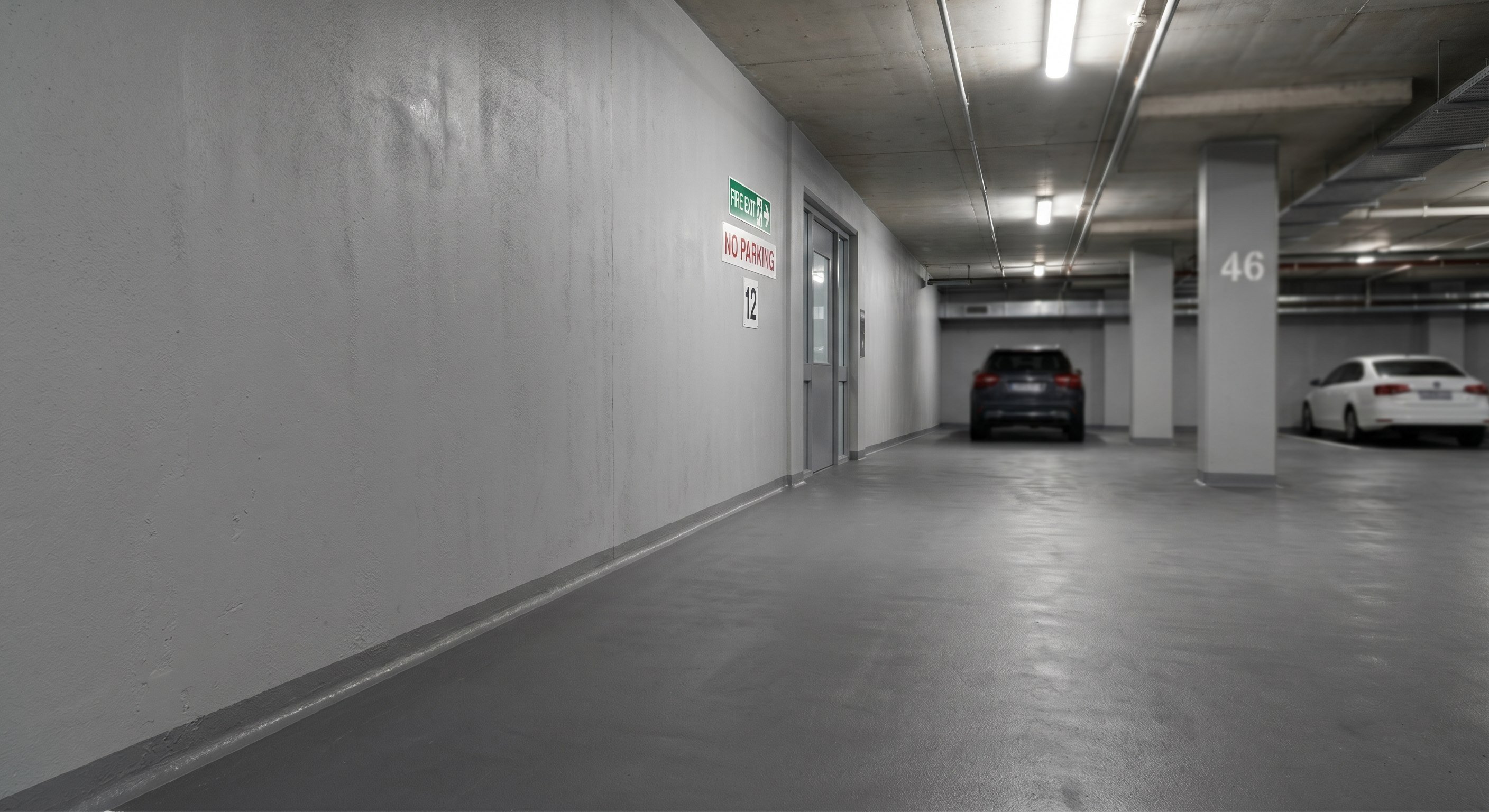 Finished sealed lift pit or sump corner in a basement parking level